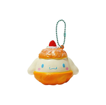 "Cinnamoroll-themed squishies including a donut, cake slice, cream puff, and waffle, each designed with pastel colors and cute character details. Packaged in original Sanrio 2017 packaging, showcasing the soft, textured surface and collectible charm."