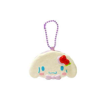 "Cinnamoroll-themed squishies including a donut, cake slice, cream puff, and waffle, each designed with pastel colors and cute character details. Packaged in original Sanrio 2017 packaging, showcasing the soft, textured surface and collectible charm."