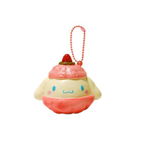 "Cinnamoroll-themed squishies including a donut, cake slice, cream puff, and waffle, each designed with pastel colors and cute character details. Packaged in original Sanrio 2017 packaging, showcasing the soft, textured surface and collectible charm."