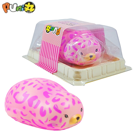 Puni Maru Jumbo Leopard Mochi Seal squishy shown in yellow and pink leopard print variations. Features a large, soft seal with spotted pattern, closed eyes, and blush cheeks. Made from scented, slow-rising PU foam. Measures 6 inches long and packaged in a clear, re-closable display box from the 2017 release.