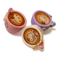 Hello Kitty Lovely Sweets Squishy Series featuring three designs: a latte cup, a shortcake slice, and a donut. Each squishy is soft, slow-rising, and decorated with Hello Kitty-themed details. Packaged in original licensed packaging with tags. Vintage production with slight aging may be visible.