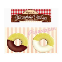 Cafe de N Chocolate Fondue Pineapple squishy in original packaging, shaped like a realistic pineapple dipped in either dark or white chocolate; features glossy drizzle detail, textured surface, and comes with a tag for authenticity.