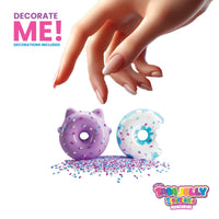 Decorative donuts with sprinkles and a hand reaching towards them, featuring the Tabool Jelly brand.