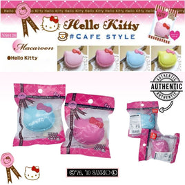 Super rare Hello Kitty Sweets Cafe macaron squishy with textured surface and signature bow, pink ball chain, and red Sanrio authenticity sticker; vintage 1976–2010 edition with possible age-related cracks or imperfections.