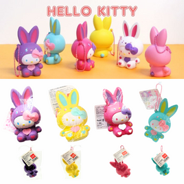 "Sanrio Hello Kitty squishy wearing a pastel bunny costume, shown in original packaging with pink ball chain and red authenticity sticker — rare collectible produced between 1976 and 2010."
