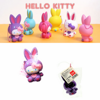 "Sanrio Hello Kitty squishy wearing a pastel bunny costume, shown in original packaging with pink ball chain and red authenticity sticker — rare collectible produced between 1976 and 2010."