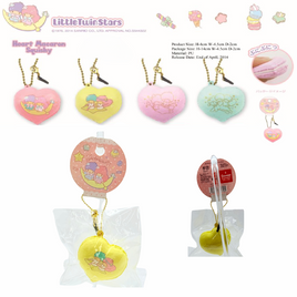 "Little Twin Star heart-shaped macaron squishy featuring pastel Kiki and Lala, includes gold ball chain and dust plug, displayed in original licensed Sanrio packaging, rare vintage collectible produced between 1976 and 2014."