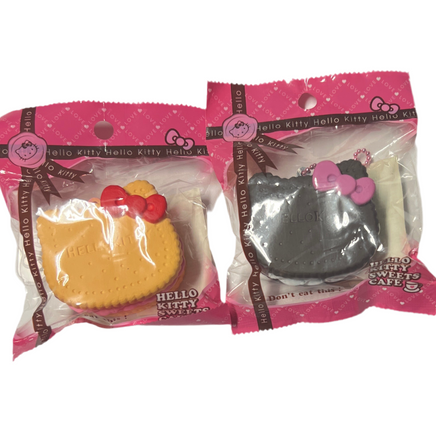 RARE Hello Kitty Sweets Cafe Rusk Biscuit Squishy featuring a golden brown biscuit design with embossed Hello Kitty details, attached pink ball chain, and red Sanrio authenticity sticker; vintage item from 1976–2010, not slow rising, shown in original condition.