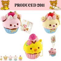 Rilakkuma Strawberry Cupcake Squishy from 2011 in original packaging with tags and gold ball chain, rare collectible perfect as bag charm, keychain, or accessory.