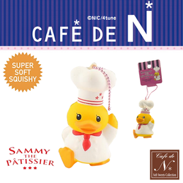 Sammy The Patissier Duck Squishy with pink ball chain, licensed collectible in original packaging, adorable yellow duck design for squishy or duck collectors.
