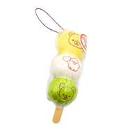 Super rare Rilakkuma Dango squishy featuring three pastel mochi-style balls on a skewer with Rilakkuma’s face, shown in original packaging with tag; vintage item with possible signs of age like cracks or imperfections.