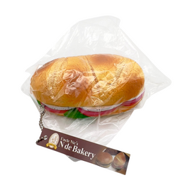 Realistic vintage panini sandwich squishy from Uncle Nic’s N de Bakery, with toasted texture, golden color, and detailed bread design; aged item with possible cracks.