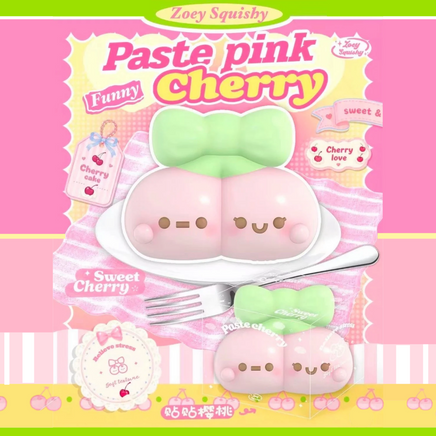 Zoey Pastel Pink Cherry Squishy with an adorable kawaii face, jumbo pink cherry design, super squishy slow-rising texture and delightful scent, displayed in a protective plastic box.