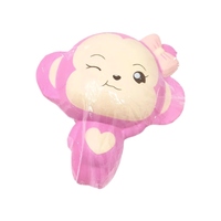 Pink monkey-shaped balloon with a heart on a white background