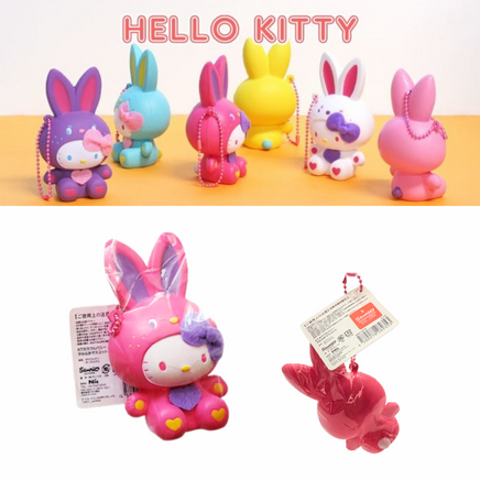 "Sanrio Hello Kitty squishy wearing a pastel bunny costume, shown in original packaging with pink ball chain and red authenticity sticker — rare collectible produced between 1976 and 2010."