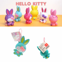 "Sanrio Hello Kitty squishy wearing a pastel bunny costume, shown in original packaging with pink ball chain and red authenticity sticker — rare collectible produced between 1976 and 2010."