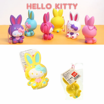 "Sanrio Hello Kitty squishy wearing a pastel bunny costume, shown in original packaging with pink ball chain and red authenticity sticker — rare collectible produced between 1976 and 2010."