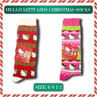 Hello Kitty kids knee-high Christmas socks featuring festive red, green, and white holiday colors with a cute Sanrio design. Cozy, stretchy, and sized for kids 6–8.5.