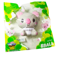 Three licensed I-Bloom Koala squishies in blue (KEN), gray (LUDLOW), and pink (BELLE), each with soft, rounded features and a super slow-rising texture. Displayed in original 2017 packaging, showcasing their collectible design and pastel colors.