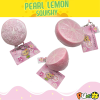 Jumbo Pearl Lemon Squishy in original packaging with Cheeka tag, lobster clasp, key ring, pink ball chain, and phone plug — rare scented collectible, super squishy and slow rising
