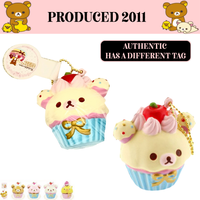 Rilakkuma Strawberry Cupcake Squishy from 2011 in original packaging with tags and gold ball chain, rare collectible perfect as bag charm, keychain, or accessory.