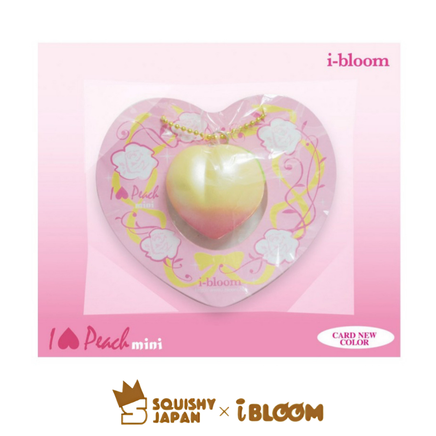 Heart-shaped squishy toy in packaging with 'i-bloom' branding on a pink background.