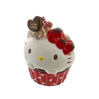 Kitty Cupcake Squishy shown in four unique designs, each featuring a cat-themed cupcake with colorful frosting and detailing. Made from soft, slow-rising material, each comes with an attached keychain and is packaged in original licensed packaging with tags.