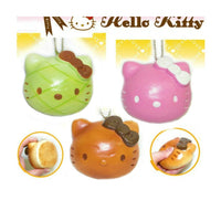 RARE Hello Kitty Sweets Cafe head bread bun squishy featuring Hello Kitty’s face on a textured bread-like surface; vintage 1976–2009 item with possible signs of age such as cracks or wear.