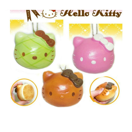 RARE Hello Kitty Sweets Cafe head bread bun squishy featuring Hello Kitty’s face on a textured bread-like surface; vintage 1976–2009 item with possible signs of age such as cracks or wear.