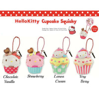 Kitty Cupcake Squishy shown in four unique designs, each featuring a cat-themed cupcake with colorful frosting and detailing. Made from soft, slow-rising material, each comes with an attached keychain and is packaged in original licensed packaging with tags.