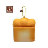 Cafe de N Bakery Bread Squishy in two color variations, 4x4 inches, soft and slow rising with a realistic bread texture, shown with original licensed tag, released May 2017.