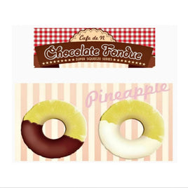 Cafe de N Chocolate Fondue Pineapple squishy in original packaging, shaped like a realistic pineapple dipped in either dark or white chocolate; features glossy drizzle detail, textured surface, and comes with a tag for authenticity.
