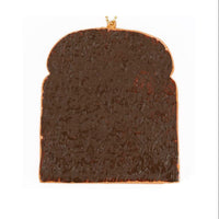 Café de N Bakery Sliced Bread squishy featuring a realistic, lightly toasted surface and soft, slow-rising texture. Made from PU foam and packaged in original Café de N packaging with tag. Released in May 2017.

