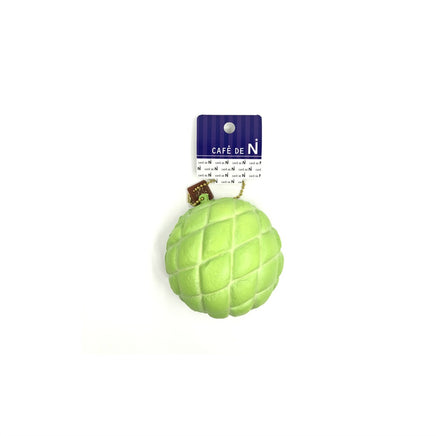 "Super squishy Cafe de N Bakery Melonpan squishy, measuring 4 inches by 4 inches, featuring a realistic melon bread texture in soft yellow tones. Packaged in original 2017 licensed bag with tag, ideal for collectors and stress relief."