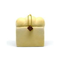 Cafe de N Bakery Bread Squishy in two color variations, 4x4 inches, soft and slow rising with a realistic bread texture, shown with original licensed tag, released May 2017.