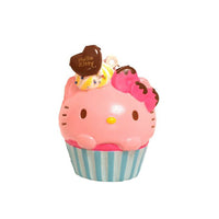 Kitty Cupcake Squishy shown in four unique designs, each featuring a cat-themed cupcake with colorful frosting and detailing. Made from soft, slow-rising material, each comes with an attached keychain and is packaged in original licensed packaging with tags.